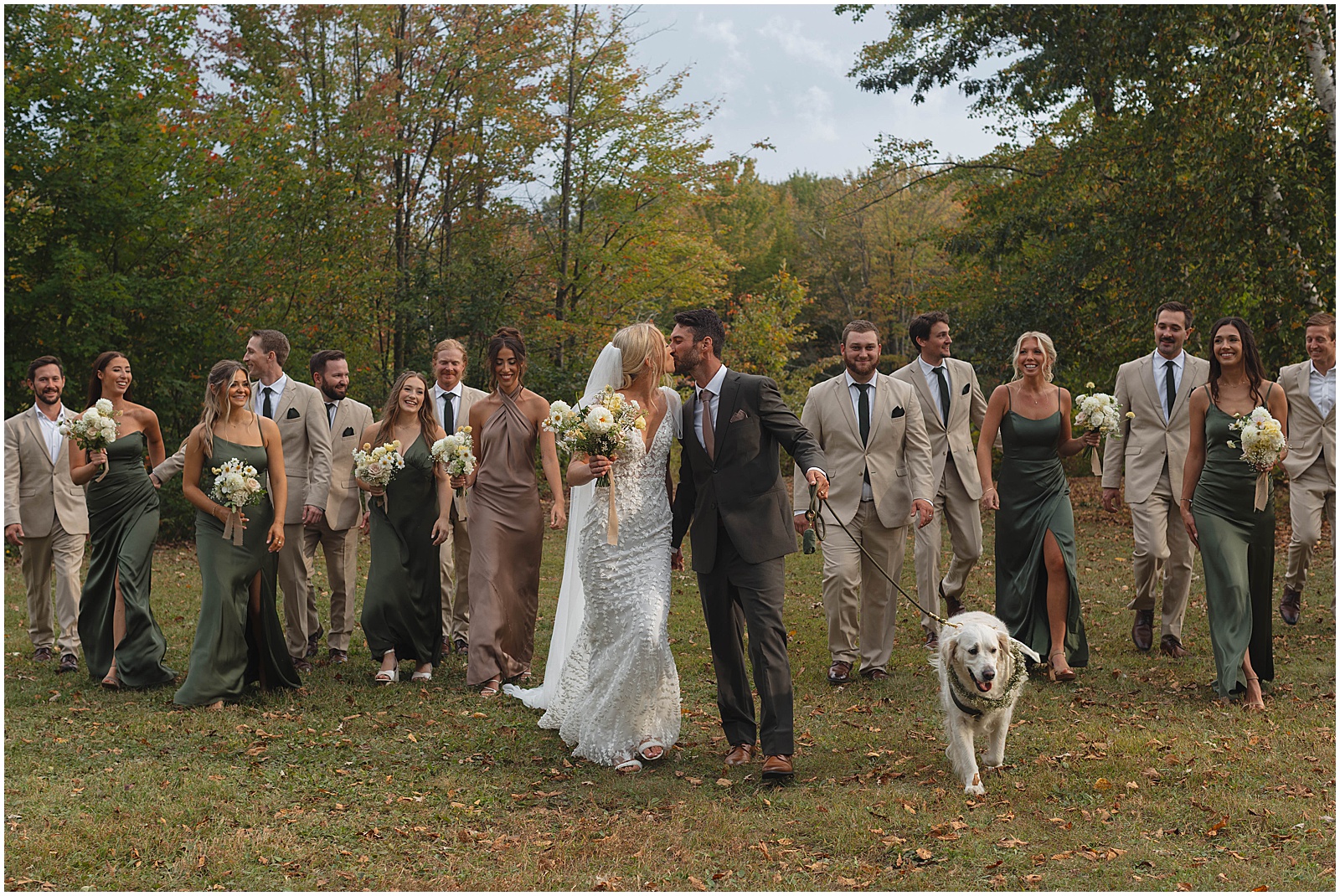 Bride and groom taking portraits with their wedding party and dog at a Wisconsin wedding