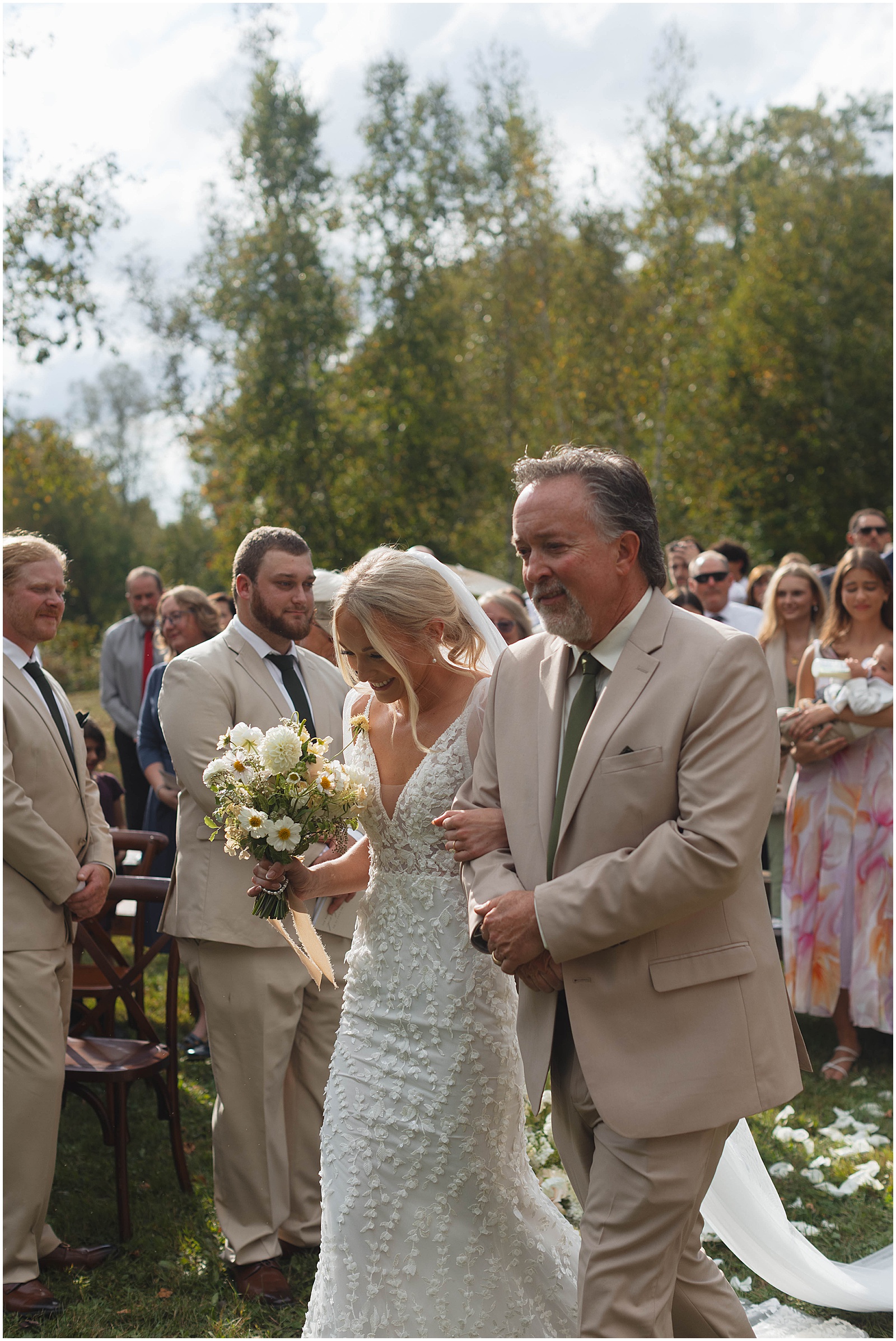 Bride walking down the aisle with her father at her Wisconsin wedding