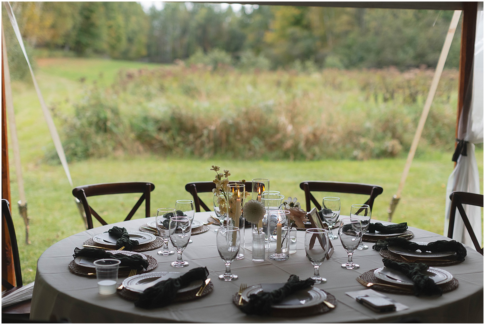 Wedding reception table decor for a Wisconsin tented campground wedding